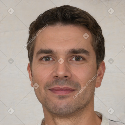 Joyful white young-adult male with short  brown hair and brown eyes