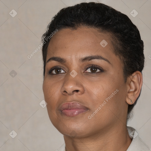 Joyful black young-adult female with short  black hair and brown eyes