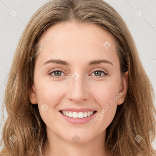 Joyful white young-adult female with long  brown hair and green eyes