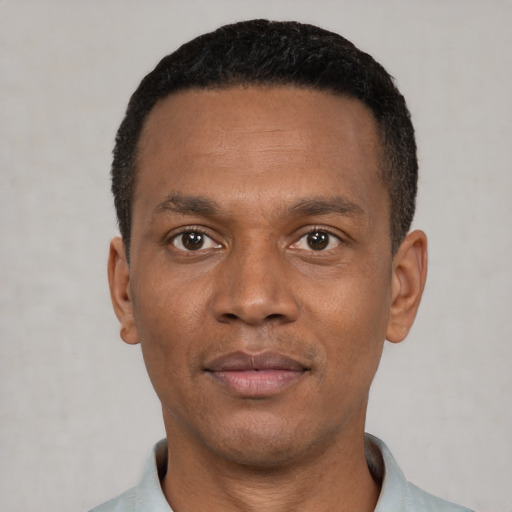 Neutral latino adult male with short  black hair and brown eyes