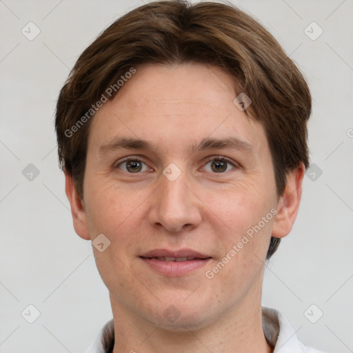 Joyful white adult male with short  brown hair and grey eyes