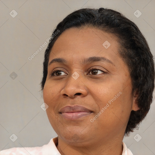 Joyful asian adult female with short  brown hair and brown eyes