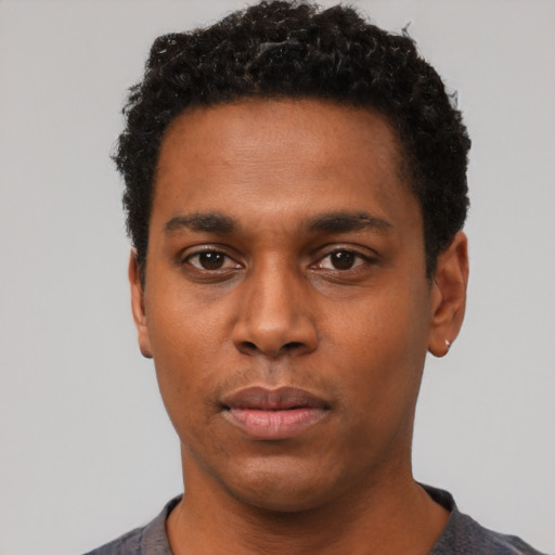 Neutral black young-adult male with short  black hair and brown eyes