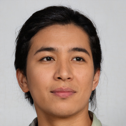 Joyful asian young-adult male with medium  black hair and brown eyes