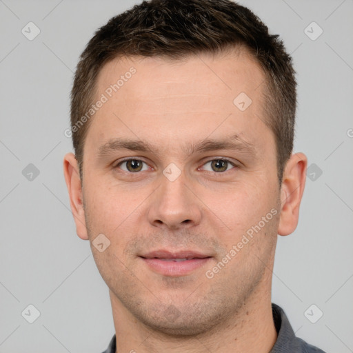 Joyful white young-adult male with short  brown hair and grey eyes