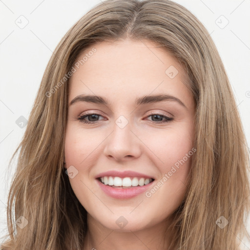 Joyful white young-adult female with long  brown hair and green eyes