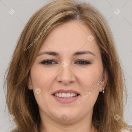 Joyful white young-adult female with long  brown hair and brown eyes