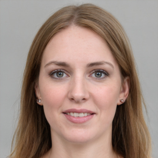 Joyful white young-adult female with long  brown hair and grey eyes