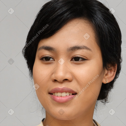 Joyful asian young-adult female with medium  black hair and brown eyes