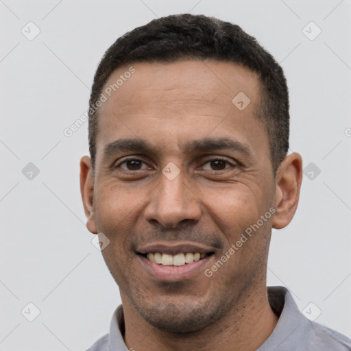 Joyful white young-adult male with short  black hair and brown eyes