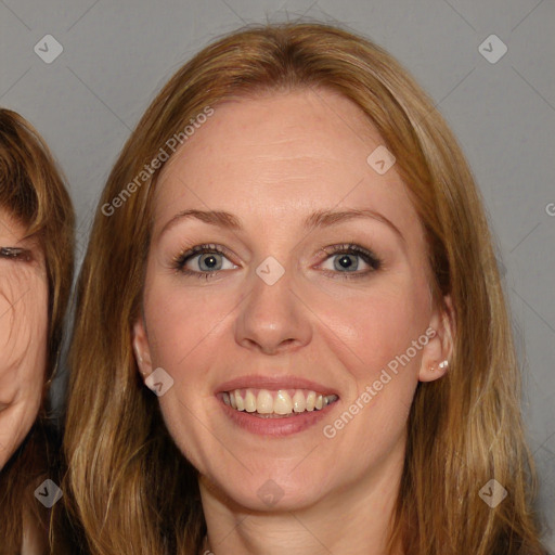 Joyful white adult female with long  brown hair and brown eyes