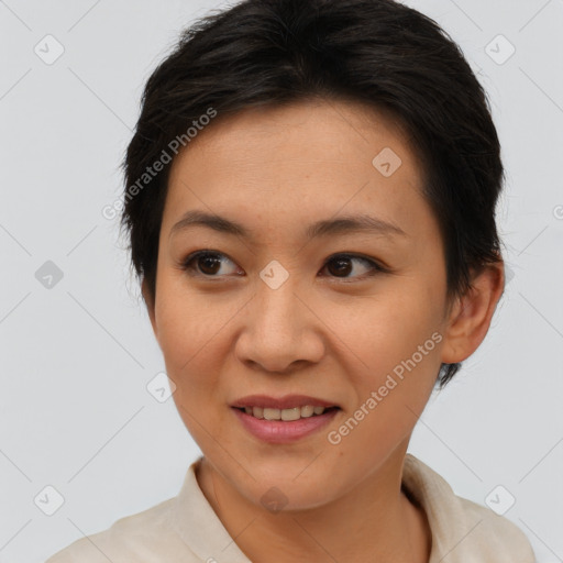 Joyful asian young-adult female with short  brown hair and brown eyes