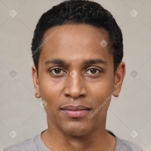 Joyful black young-adult male with short  black hair and brown eyes