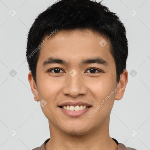 Joyful latino young-adult male with short  black hair and brown eyes