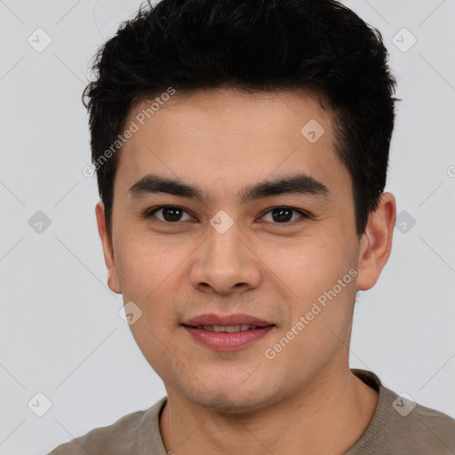 Joyful asian young-adult male with short  black hair and brown eyes