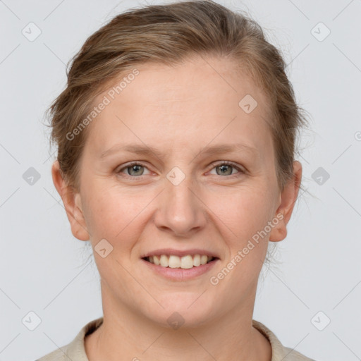 Joyful white adult female with medium  brown hair and grey eyes