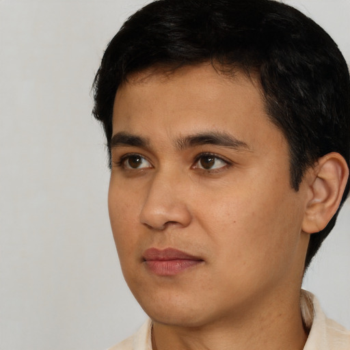 Neutral latino young-adult male with short  black hair and brown eyes