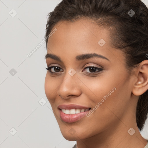 Joyful latino young-adult female with medium  brown hair and brown eyes