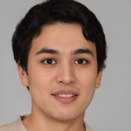 Joyful asian young-adult male with short  brown hair and brown eyes