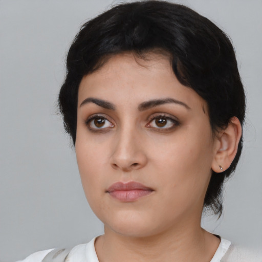 Neutral latino young-adult female with medium  black hair and brown eyes