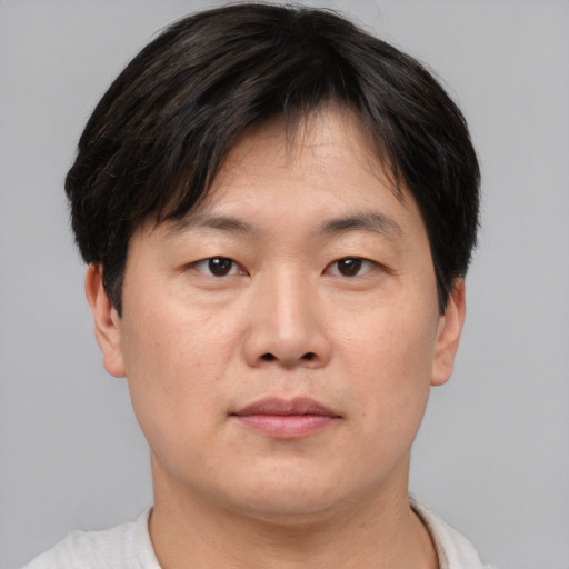 Neutral asian young-adult male with short  brown hair and brown eyes
