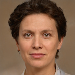 Joyful white adult female with short  brown hair and green eyes