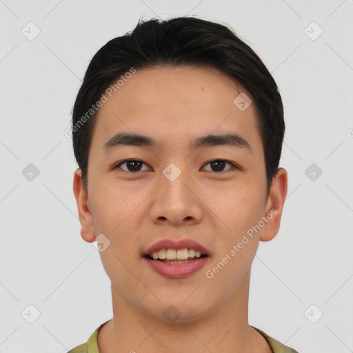 Joyful asian young-adult male with short  black hair and brown eyes