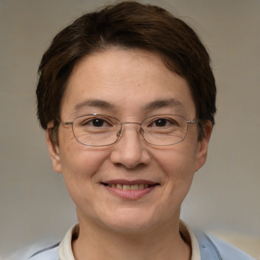 Joyful white adult female with short  brown hair and brown eyes
