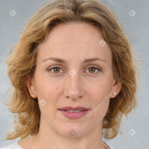 Joyful white adult female with medium  brown hair and blue eyes