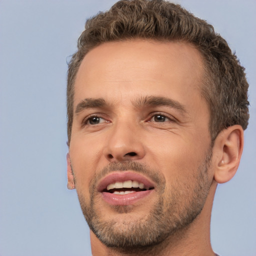 Joyful white adult male with short  brown hair and brown eyes