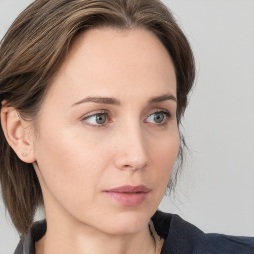 Neutral white young-adult female with medium  brown hair and blue eyes