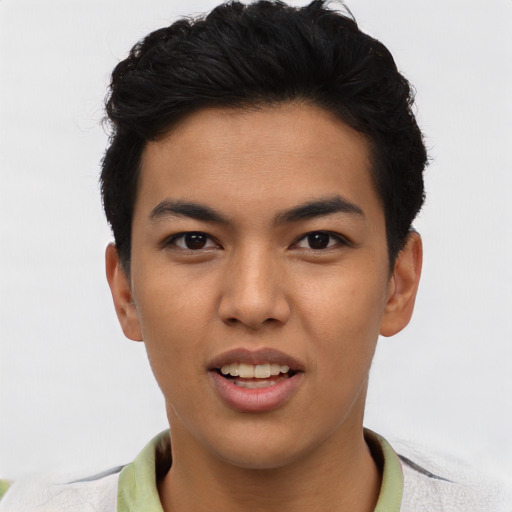 Joyful asian young-adult male with short  black hair and brown eyes