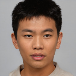 Neutral asian young-adult male with short  brown hair and brown eyes