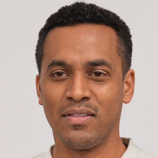 Neutral black adult male with short  black hair and brown eyes