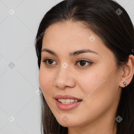 Joyful asian young-adult female with long  brown hair and brown eyes