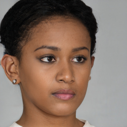 Neutral black young-adult female with short  brown hair and brown eyes