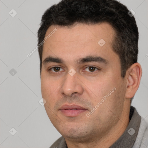 Joyful white young-adult male with short  black hair and brown eyes