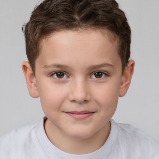 Joyful white child male with short  brown hair and brown eyes