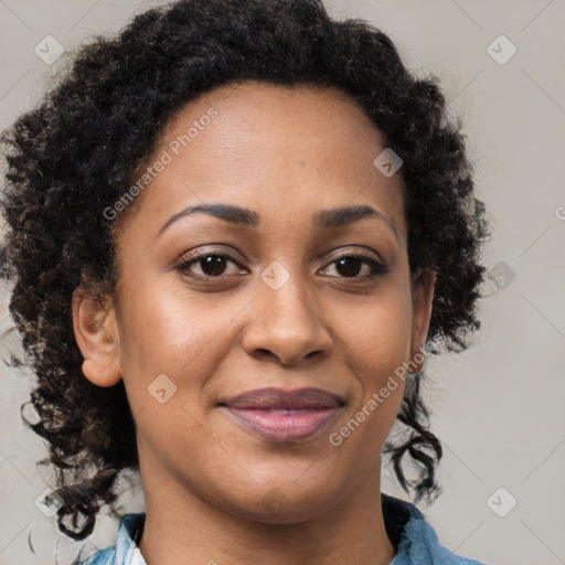 Joyful black adult female with medium  brown hair and brown eyes