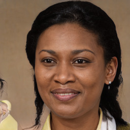 Joyful latino adult female with medium  brown hair and brown eyes