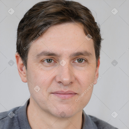 Joyful white adult male with short  brown hair and grey eyes