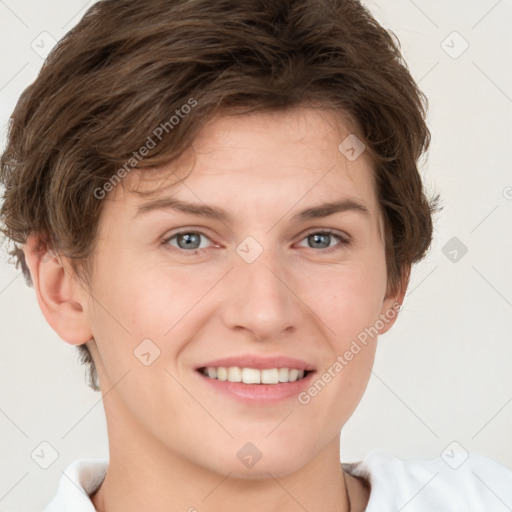 Joyful white young-adult female with short  brown hair and grey eyes