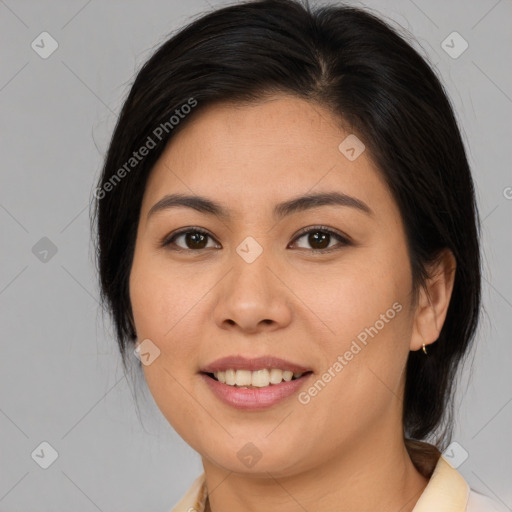 Joyful asian young-adult female with medium  brown hair and brown eyes