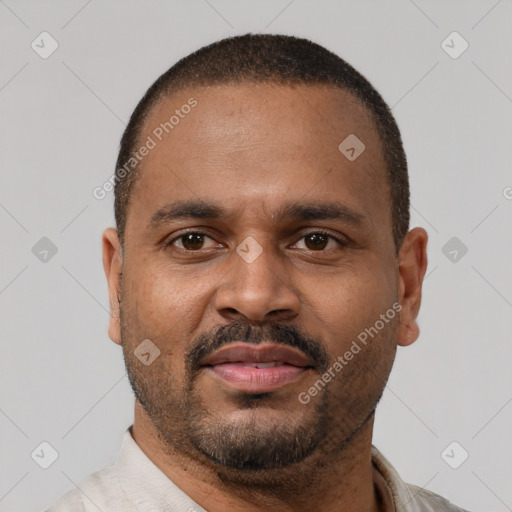 Neutral latino adult male with short  brown hair and brown eyes