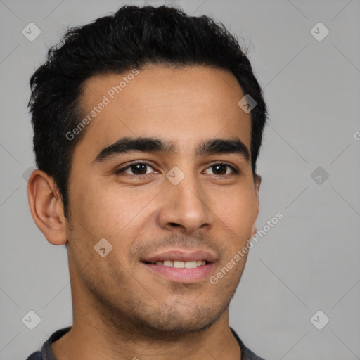 Joyful latino young-adult male with short  black hair and brown eyes