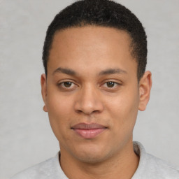 Joyful latino young-adult male with short  brown hair and brown eyes