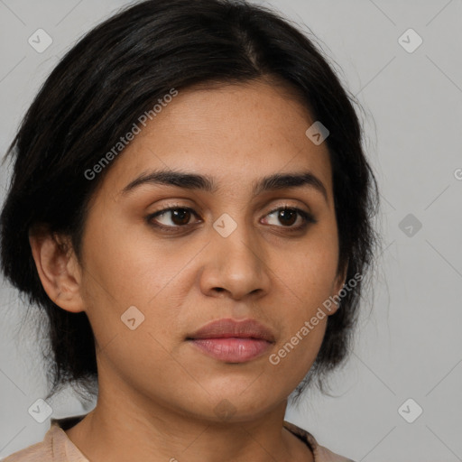 Joyful latino young-adult female with medium  black hair and brown eyes