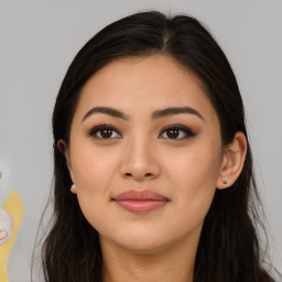 Joyful asian young-adult female with long  brown hair and brown eyes