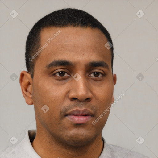 Neutral latino young-adult male with short  black hair and brown eyes