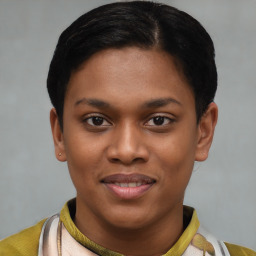 Joyful latino young-adult female with short  black hair and brown eyes